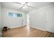 Bedroom featuring wood-look flooring, a ceiling fan, and a window offering natural light at 2811 Beech Dr, Columbus, IN 47203