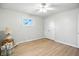 Bright bedroom featuring neutral walls, hardwood floors, and a closet for plenty of storage space at 2811 Beech Dr, Columbus, IN 47203