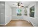 Bright dining room with wainscoting, modern light fixture and updated flooring at 2811 Beech Dr, Columbus, IN 47203
