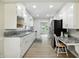 Open kitchen design, boasting modern appliances, sleek countertops, and a seamless flow to the adjoining dining area at 2811 Beech Dr, Columbus, IN 47203