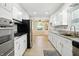 Spacious kitchen featuring modern stainless steel appliances, granite countertops, and ample cabinet space at 2811 Beech Dr, Columbus, IN 47203