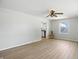 Airy living room featuring modern flooring, a ceiling fan, and views to the outside creating a comfortable space at 2811 Beech Dr, Columbus, IN 47203