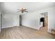 Open-concept living room with hardwood floors transitioning into an adjacent kitchen with modern appliances at 2811 Beech Dr, Columbus, IN 47203