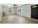 Bright living room with large windows, modern flooring, and a welcoming entrance door, creating a comfortable space at 2811 Beech Dr, Columbus, IN 47203