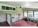 Sun room featuring brick accents, multiple windows and a ceiling fan at 2811 Beech Dr, Columbus, IN 47203