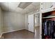Simple bedroom with closet, wood paneling, and hardwood floors at 29 E Caven St, Indianapolis, IN 46225