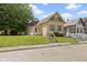 Exterior view of a charming home with a well-maintained lawn at 29 E Caven St, Indianapolis, IN 46225
