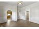 Bright living room features wood floors, white trim, and a ceiling fan at 29 E Caven St, Indianapolis, IN 46225