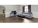 Comfortable living room with hardwood floors, desk space, and natural light at 29 E Caven St, Indianapolis, IN 46225
