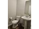 Powder room with pedestal sink, toilet, and modern finishes at 3068 Gibbert Ln, Westfield, IN 46074