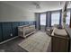 Cozy Bedroom with blue accent wall and ample natural light at 3068 Gibbert Ln, Westfield, IN 46074