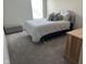 This bedroom features soft gray carpet and matching bedding with a padded headboard and ample natural light at 3068 Gibbert Ln, Westfield, IN 46074