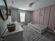 Charming bedroom with pink accent wall and floral accents at 3068 Gibbert Ln, Westfield, IN 46074