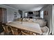 Bright dining room with a wooden table and chairs open to living room at 3068 Gibbert Ln, Westfield, IN 46074