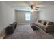 Spacious living room with a ceiling fan, a large sofa and a coffee table on carpet at 3068 Gibbert Ln, Westfield, IN 46074