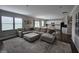 Open-concept living room with a large sectional couch, open to the kitchen at 3068 Gibbert Ln, Westfield, IN 46074