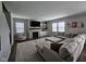 Comfortable living room features a fireplace, large sectional, and bright windows at 3068 Gibbert Ln, Westfield, IN 46074