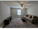 Living room with a sofa, coffee table, tv console, and large window at 3068 Gibbert Ln, Westfield, IN 46074