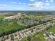 Aerial shot of neighborhood, featuring ponds, lush green landscaping, and convenient access to the city at 3341 Carica Dr, Indianapolis, IN 46203