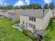 A quaint backyard featuring a small deck, shed, and fenced in lawn at 3341 Carica Dr, Indianapolis, IN 46203