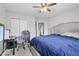 Bedroom with a comfy bed, functional desk area, and ample closet space at 3341 Carica Dr, Indianapolis, IN 46203