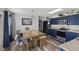 An eat-in kitchen featuring an attached dining space, stainless steel appliances, and custom light fixtures at 3341 Carica Dr, Indianapolis, IN 46203