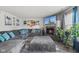 Comfortable living room with a large sectional sofa, fireplace, hardwood flooring, and lots of natural light at 3341 Carica Dr, Indianapolis, IN 46203