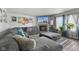 A luxurious living room with a large sectional sofa, fireplace, and natural light at 3341 Carica Dr, Indianapolis, IN 46203