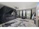 This main bedroom suite features a black canopy bed, ceiling fan, and large windows at 3341 Carica Dr, Indianapolis, IN 46203