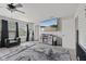 This main bedroom includes a television, ceiling fan and two windows for natural light at 3341 Carica Dr, Indianapolis, IN 46203