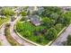 An aerial view of a beautiful home featuring a well-manicured lawn and mature trees in a serene neighborhood at 3399 Nottinghill Blvd, Plainfield, IN 46168