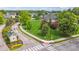 Aerial view of home at intersection with maintained lawn, trees and landscaping at 3399 Nottinghill Blvd, Plainfield, IN 46168