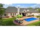 Spacious backyard featuring a pool, patio area, and well-maintained landscaping at 3399 Nottinghill Blvd, Plainfield, IN 46168