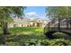 Beautiful backyard showcasing a well maintained lawn and bridge feature at 3399 Nottinghill Blvd, Plainfield, IN 46168
