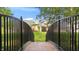Idyllic backyard view with bridge, lush greenery, and outdoor seating at 3399 Nottinghill Blvd, Plainfield, IN 46168