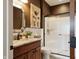 Stylish bathroom with a granite vanity, shower with glass doors and decorative art at 3399 Nottinghill Blvd, Plainfield, IN 46168