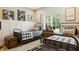 Charming bedroom features two twin beds, rustic decor and natural light from the window at 3399 Nottinghill Blvd, Plainfield, IN 46168