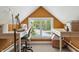 Bright bonus room features a large window with street views and desk area for crafting at 3399 Nottinghill Blvd, Plainfield, IN 46168