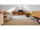 Spacious bonus room features a TV, exercise equipment and ample space for activities at 3399 Nottinghill Blvd, Plainfield, IN 46168