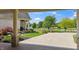 View of the landscaped front yard with a long driveway and stone pillar accents at 3399 Nottinghill Blvd, Plainfield, IN 46168