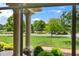 Scenic view of the landscaped front yard and neighborhood through pillars at 3399 Nottinghill Blvd, Plainfield, IN 46168