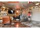 Garage interior features a TV, leather recliner, bicycles and unique rustic decor at 3399 Nottinghill Blvd, Plainfield, IN 46168