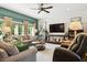 Inviting living room with comfortable seating, warm lighting, and stylish decor creates a relaxing ambiance at 3399 Nottinghill Blvd, Plainfield, IN 46168