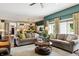 An open concept living room and kitchen featuring hardwood floors, lots of natural light and contemporary design at 3399 Nottinghill Blvd, Plainfield, IN 46168