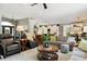 A bright, open-concept living room flowing into a modern kitchen, perfect for entertaining and Gathering gatherings at 3399 Nottinghill Blvd, Plainfield, IN 46168