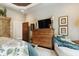Spacious main bedroom featuring a sitting area, dresser, stylish decor, and an en suite bathroom at 3399 Nottinghill Blvd, Plainfield, IN 46168