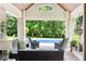 Charming poolside patio with ample seating and picturesque view of backyard landscaping at 3399 Nottinghill Blvd, Plainfield, IN 46168