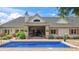Elegant home with a beautiful backyard swimming pool and covered patio area at 3399 Nottinghill Blvd, Plainfield, IN 46168