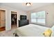 Bedroom with a TV on a dresser, closet, and a window offering natural light at 3443 Thomas Jefferson St, Westfield, IN 46074