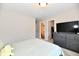 Bedroom includes a dresser with TV and access to two other rooms at 3443 Thomas Jefferson St, Westfield, IN 46074